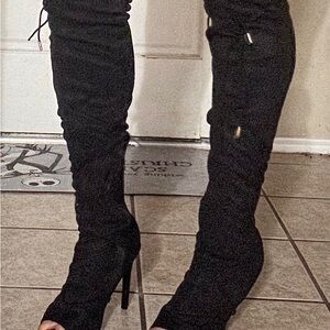 Black suede stiletto knee-high boots